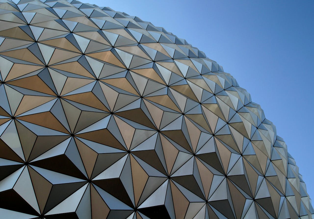Close-up of Epcot's iconic geodesic dome at Disney World, a symbol of futuristic architecture.